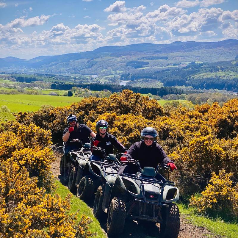 a motorcycle is parked on the side of a mountain
