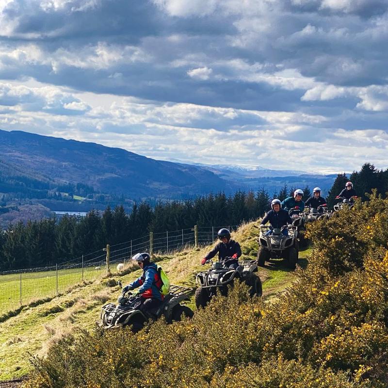 a motorcycle parked on the side of a mountain