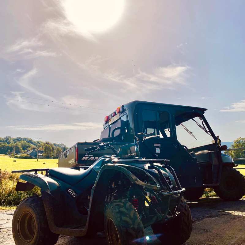 a truck is parked on the side of a mountain