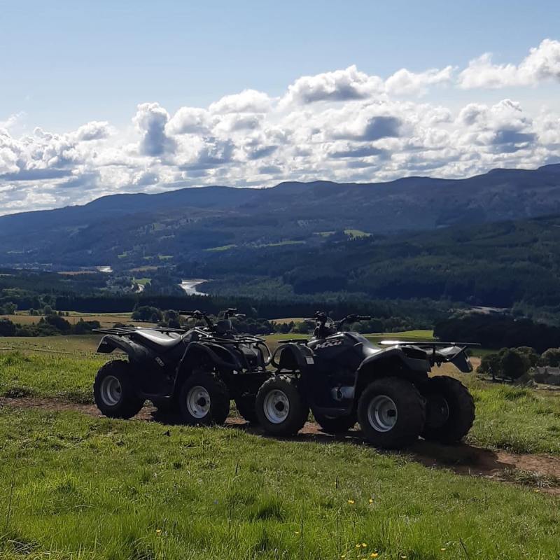 a truck is parked on the side of a mountain