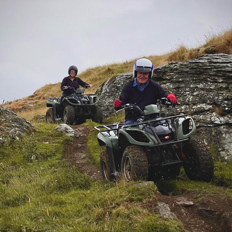 a couple of people that are sitting on a motorcycle